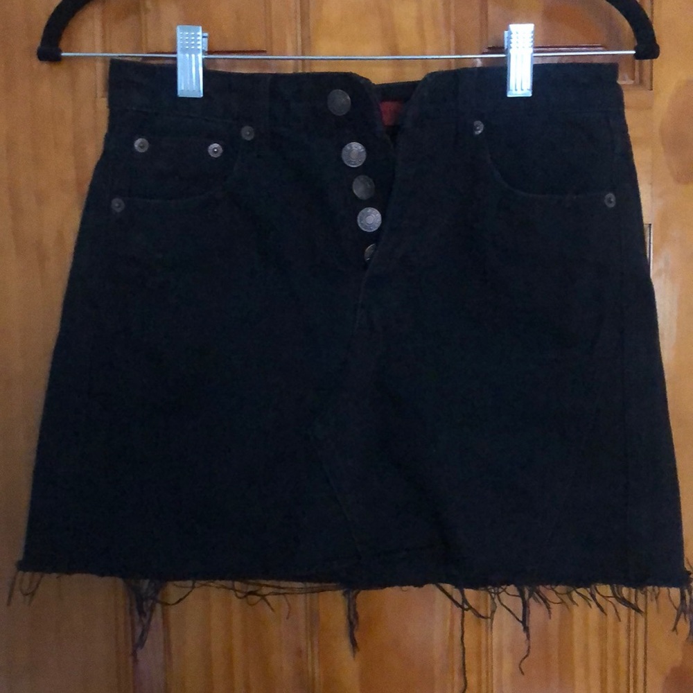 Black distressed denim mini.